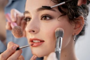 make-up-artist-getting-model-ready-photoshootin_23-2149305147